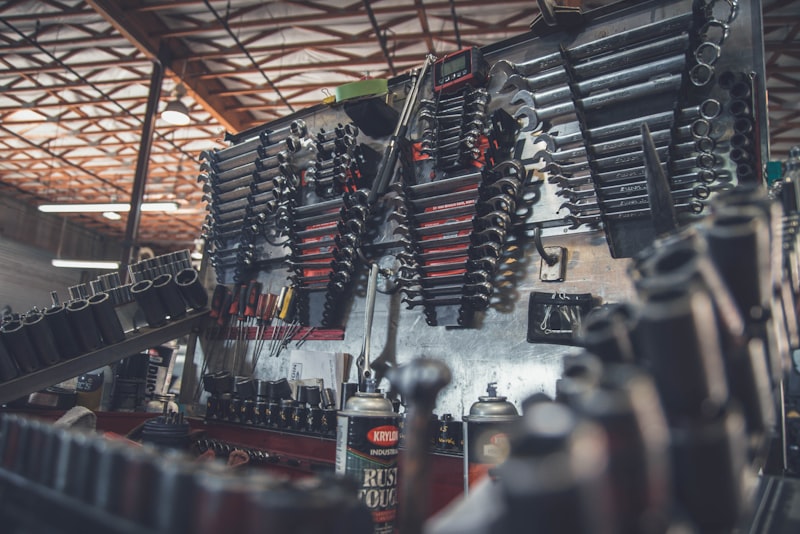 Fresh engine oil being poured into a car engine through a funnel.